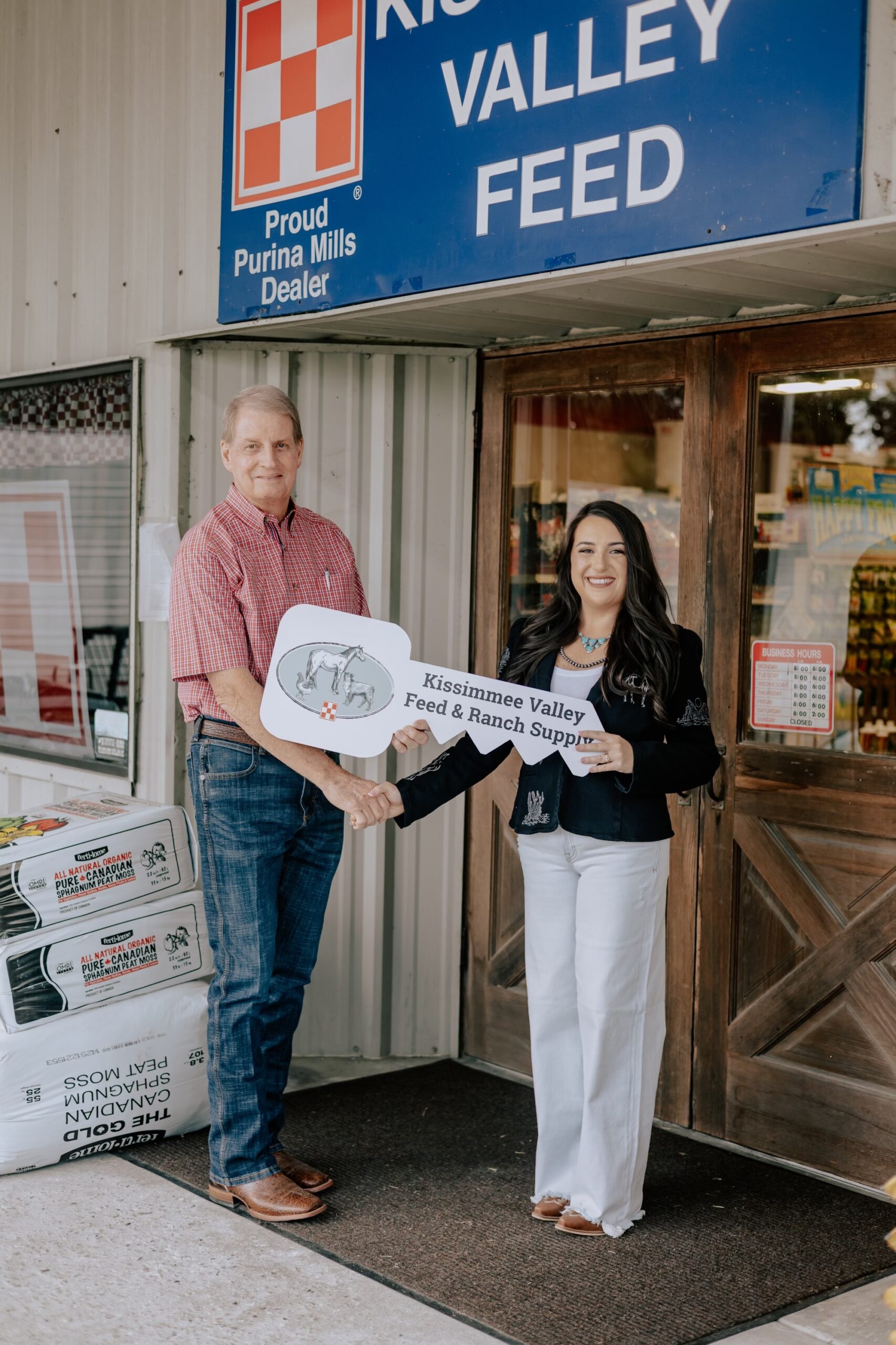 Stan Handing Over the Keys to Kissimmee Valley Feed to Samantha Holloway