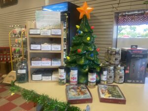 Small Christmas Tree Display at Main Store featuring soap, seasoning, pecans and cards.